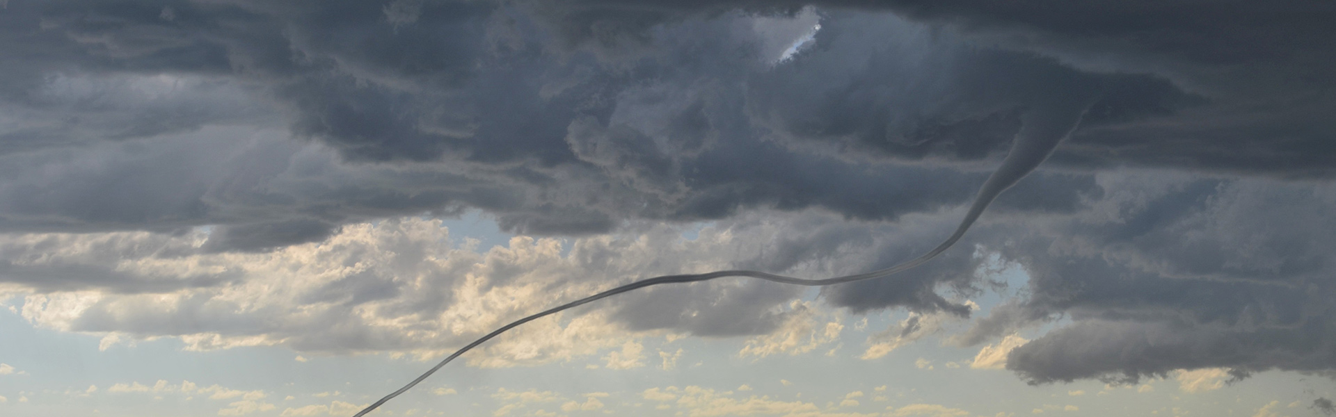 a funnel cloud tornado being tracked by Western's Severe Storms Lab